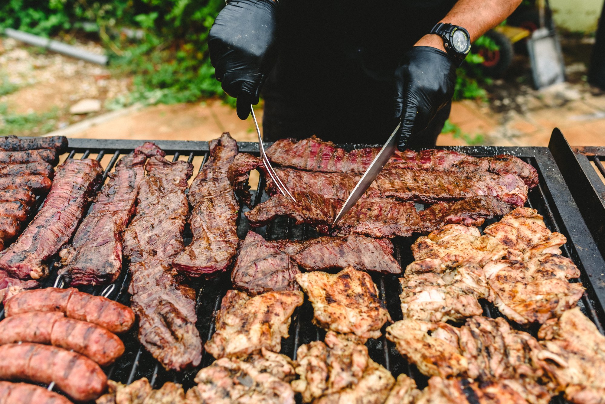 Man Grilling Meat